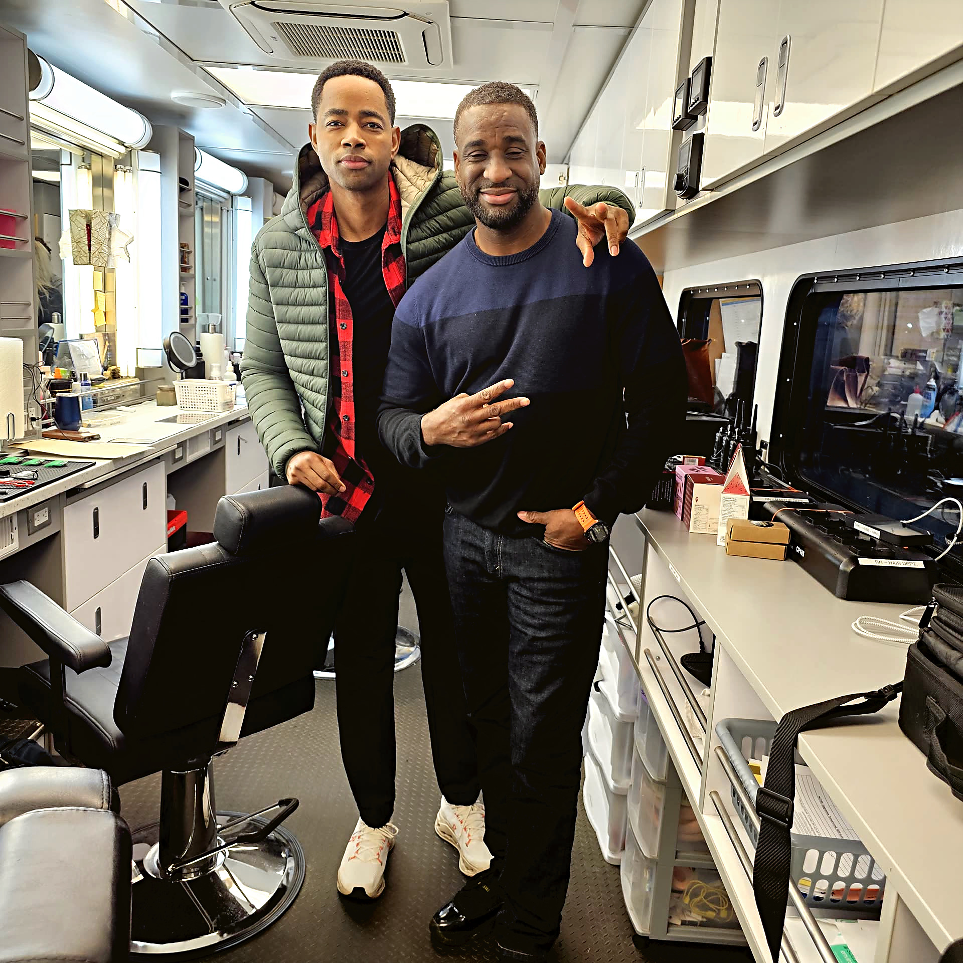 Junior with Jay Ellis beside the set chair