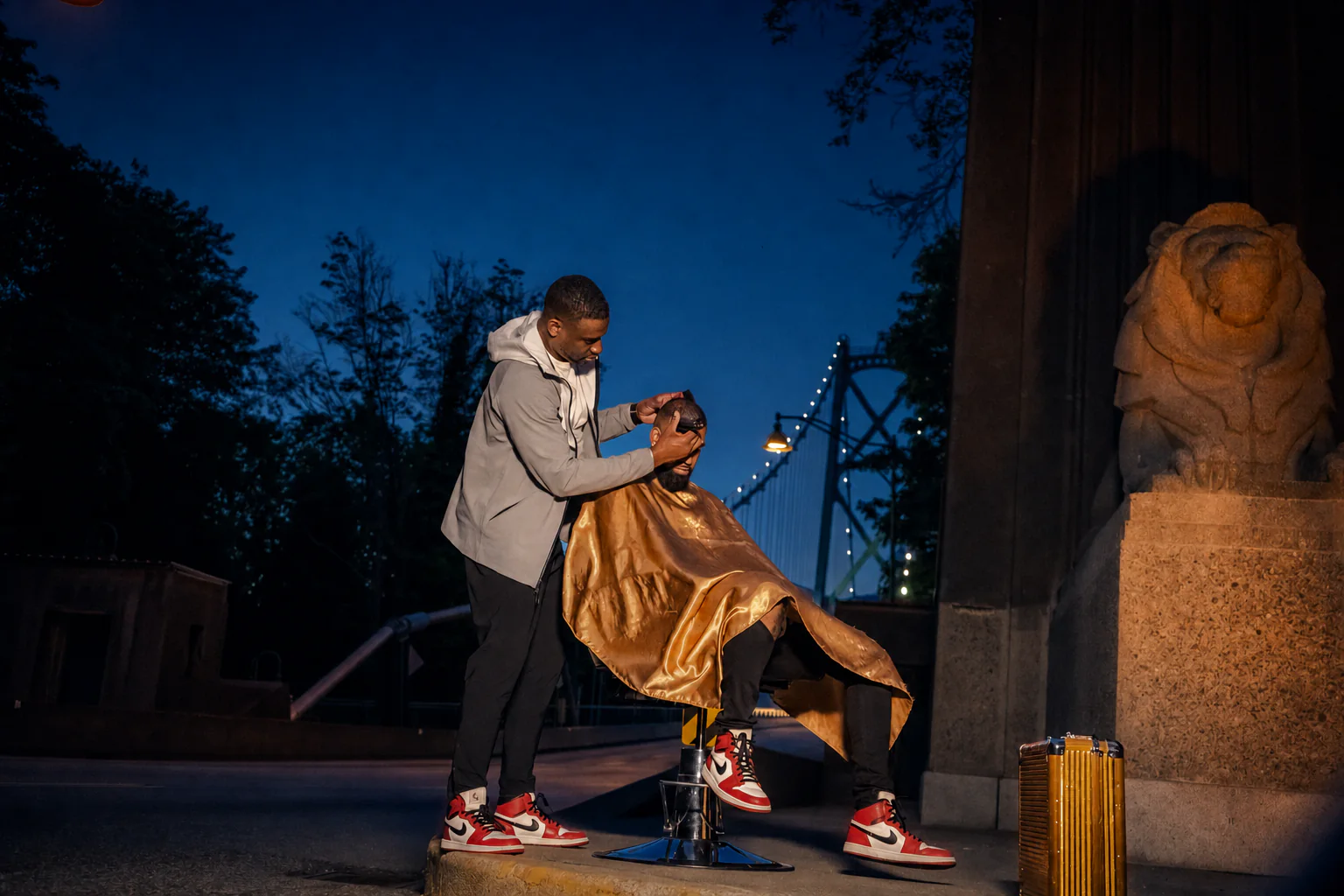 Junior shaping a client's haircut